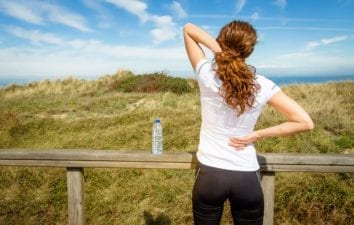 Women Athlete Experiencing Neck and Back Pain
