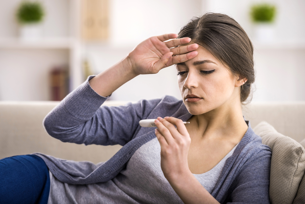 Woman sick with a rheumatoid arthritis fever