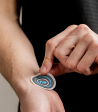 A FIT® Therapy Universal Patch applied to the wrist